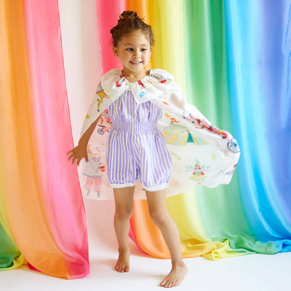 Girl dancing while wearing Silk Circus Cape