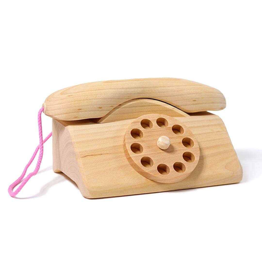 Grimm's Wooden Telephone in natural wood with large wooden dial and pink cord