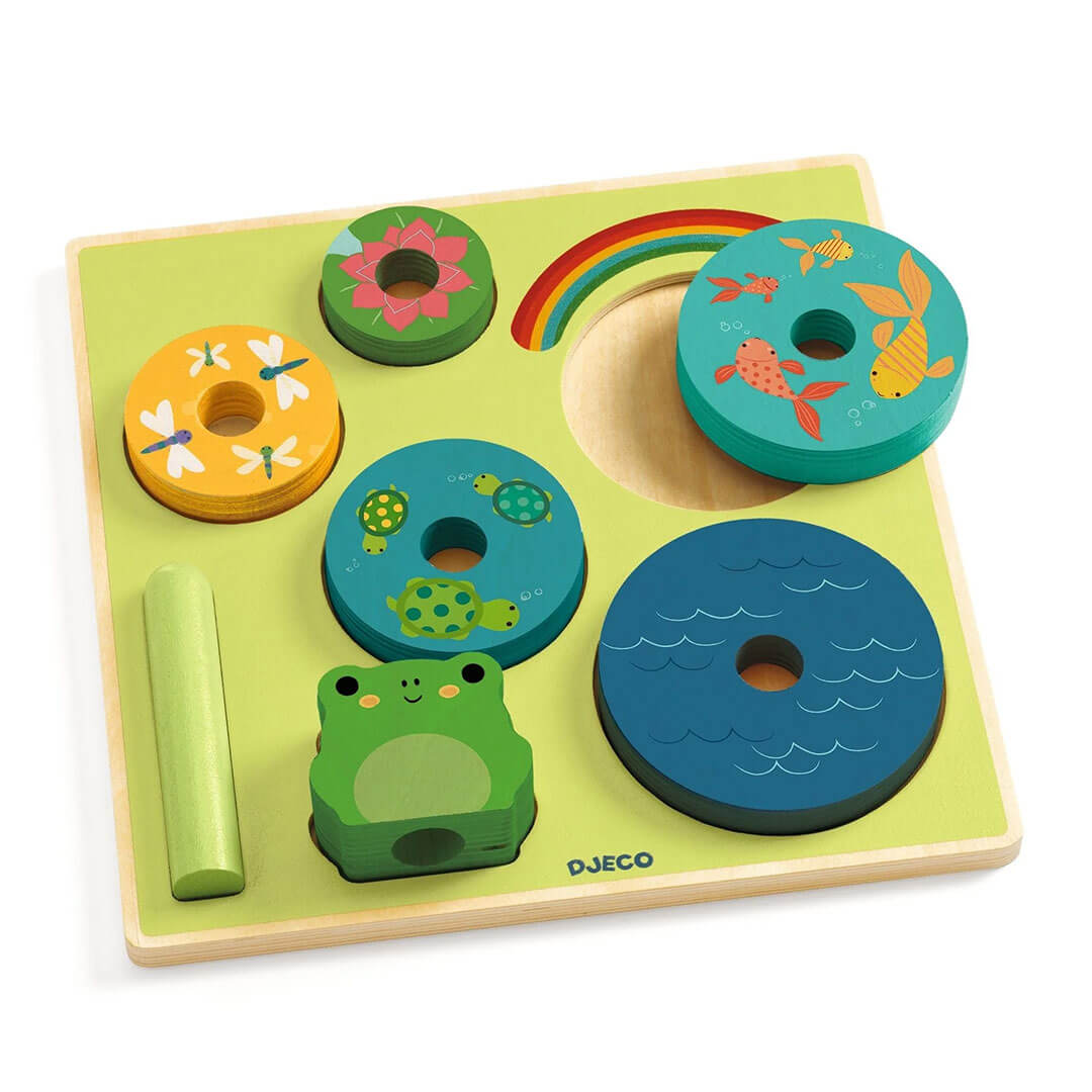 Puzz & Stack Frog Rainbow Wooden Puzzle and Stacking Toy with green wooden board with 5 round discs, 1 cylinder, and 1 frog all with similarly shaped slots in the board