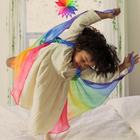 Child playing in Silk Fairy Wings